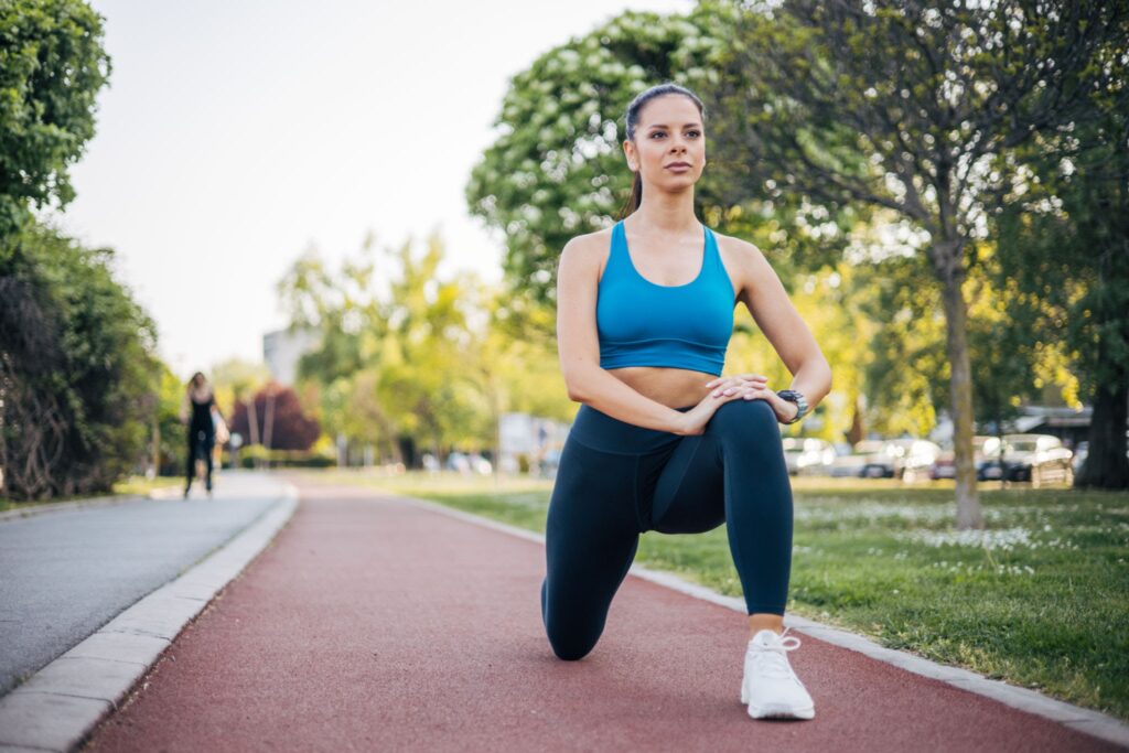 Young Fitness woman doing side lunges exercises for leg muscle workout training